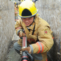Fire Training Students
  -photo Mike Wakefield  May10/17
 
 Fire Fighter training for High school students ,part of Career Day 2017 through the NVSD44 . Students from across the District were brought to the NV Fire Training centre and run through some fire fighter training.Capt Gunther Kramer leads a group through fire suppression training.-News