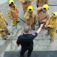 Fire Training Students
  -photo Mike Wakefield  May10/17
 
 Fire Fighter training for High school students ,part of Career Day 2017 through the NVSD44 . Students from across the District were brought to the NV Fire Training centre and run through some fire fighter training.Capt Gunther Kramer leads a group through fire suppression training.-News