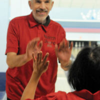NS Bowl3 Special Olympians 
 Mar 22-18
Gary Jones high fives a teammate during play.
photo Mike Wakefield